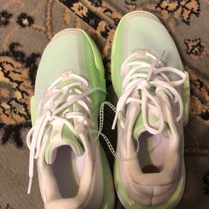 Adidas solematch sneakers in glow green.